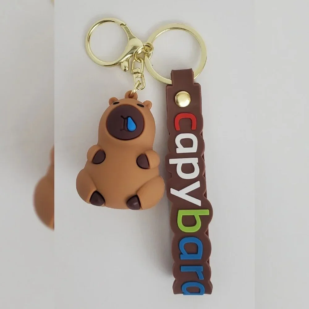 NWT CAPYBARA KEY CHAIN DIFFERENT ACTIONS 3D LOGO